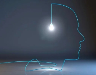 silueta de una cara humana creada con el cable de un bombillo